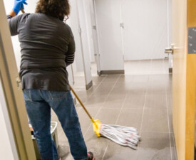 5 Star Janitorial employee mopping the floor